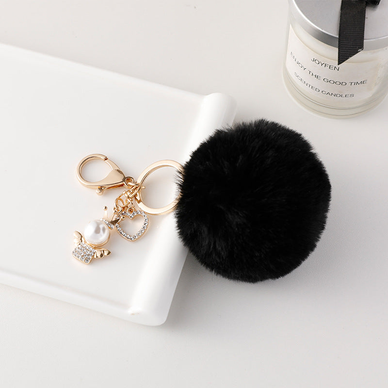 Wholesale of Cute Diamond Inlaid Angel Fur Ball Metal Keychains